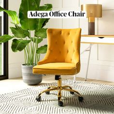 a yellow office chair sitting on top of a rug next to a potted plant