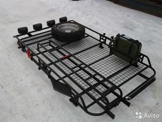 a truck bed with a tire on it in the snow