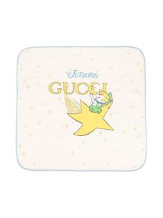 a baby blanket with a cartoon character on the front and bottom, that says gucci