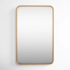 a square mirror hanging on the wall