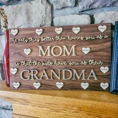 a wooden sign that says, the only thing better than having you as a mom