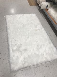 a white rug on the floor in a store