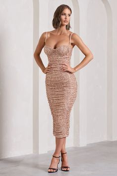 Saturated in sparkling sequins, New Energy is sure to make heads turn at your next event. Arriving in a fully ruched bodycon silhouette, this figure-skimming midi dress offers support through its wired padded cups and adjustable cami straps. For the perfect work party attire, compliment this gold piece with some gold heels like Rotation. Features - Premium stretch sequin jersey - Bodycon fit - Fully ruched- Sweetheart neckline - Padded wired cups- Adjustable cami straps- Invisible zip closure- Midi length Sizing & Fit Model is 5'8 and wears UK size 8 / US size 4 Product Information Designed exclusively by Club L London Fully lined with some stretch Premium sequinned jersey in Gold (95% Polyester, 5% Elastane) 125cm total length SKU: CL132055007 Sequin Jersey, Midi Bridesmaid Dress, Velvet Prom Dress, Party Attire, Black Tie Gala, Mesh Bodycon Dress, Bodycon Midi Dress, Work Party, Gold Piece