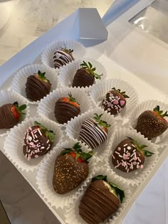 chocolate covered strawberries are arranged in a box