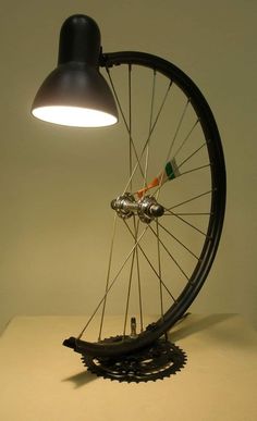 a light that is on top of a bike wheel with the spokes still attached