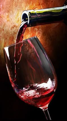 red wine being poured into a glass with an animal head sticking out of the top