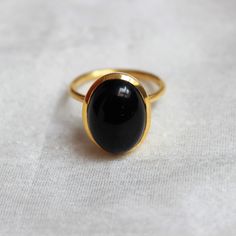 D E T A I L S - Material: 925 Sterling Silver Stone: Black Onyx Stone Shape: Square The fit: True to US ring size Finish: Smooth and gold plated to a high shine S H I P P I N G & P R O D U C T I O N - My current production time is 2-6 business days, which means after those days are up, your order ships! I make everything custom to order, by hand, but I promise you it's worth the wait! R U S H - M Y - O R D E R - If you're in a rush to get your pretty new pieces, please send me a message and Classic Black Oval Cabochon Ring, Oval Black Enamel Rings For Anniversary, Classic Oval Black Enamel Ring, Classic Black Enamel Oval Ring, Elegant Black Oval Dome Ring, Oval Onyx Rings For Anniversary, Minimalist Onyx Oval Ring, Onyx Oval Cabochon Rings For Gift, Oval Cabochon Onyx Ring Gift