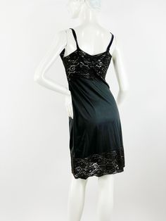 "Beautiful 1950s black nylon slip with sheer lace bodice and hem. Lace is lined with sheer nylon chiffon. Satin ribbon straps. Good condition. By Movie Star. Size 34. Measurements Bust 34\" Waist 29\" Hip 38\" Length 38\"" Black Slip Dress With Lace Bodice, Black Sleeveless Camisole With Lace Patchwork, Black Slip Dress With Lace Bodice For Party, Sheer Fitted Camisole For Evening, Lace Camisole Slip Dress For Evening, Fitted Sheer Camisole For Evening, Black Lace Camisole With Spaghetti Straps, Coquette Spaghetti Strap Slip Dress For Evening, Black Lace Bodice Slip Dress For Party