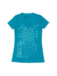 a women's blue t - shirt with an image of a peacock on it