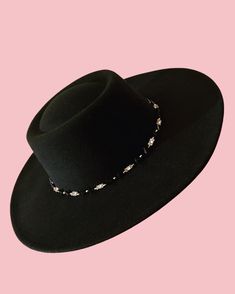 The Tanami hat features a wide brim, and carefully sewn in beads, silver metal Tibetan pieces, and metal studs around the brim.  Its a truly versatile piece which can be worn every day to elevate your outfit, or dressed up for a fancier occasion!  Size medium/large (can be fit to smaller heads by adjusting the band on the inside, and small hat padding may also be added) max 60cm circumference Elegant Black Beaded Hat, Adjustable Wide Brim Felt Hat For Evening, Adjustable Flat Brim Fedora For Evening, Embellished Adjustable Hat With Curved Brim, Elegant Handmade Rodeo Hat, Evening Fedora With Flat Brim, Adjustable Brimmed Felt Hat For Evening, Elegant Fedora Felt Hat For Festival, Elegant Handmade Hat Bands For Rodeo