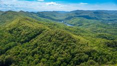 an aerial view of the mountains and trees