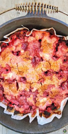 a pie sitting in a pan on top of a wooden table