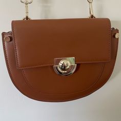 Tan cross body bag from Zara. Perfect for everyday wear. #zara #bags Brown Clutch Bag With Metal Hardware, Chic Brown Saddle Bag With Metal Hardware, Versatile Brown Satchel With Magnetic Closure, Chic Brown Pouch Saddle Bag, Chic Brown Saddle Bag Pouch, Tan Cross Body Bag, Bags Cross, Bag Women Fashion