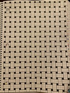 an open notebook with black and white squares on it