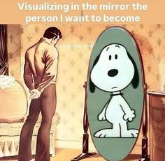 a man standing next to a mirror with a cartoon dog on it