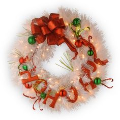 a christmas wreath with lights and bows