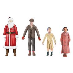 a group of people standing next to each other in front of a santa clause figure