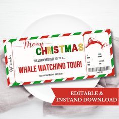 a white plate with a red and green christmas ticket on it next to an envelope