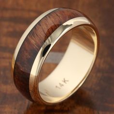 a wedding ring with a wooden inlay