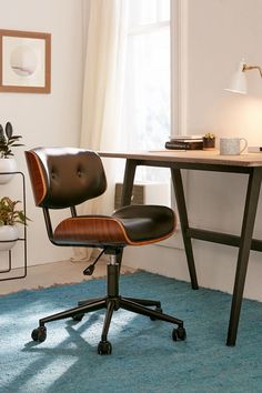 an office chair sitting in front of a desk with a lamp on top of it