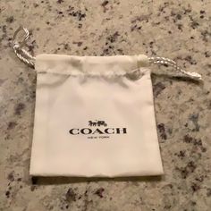 Coach Drawstring Dust Jewelry Bag New, Never Used Size: 5”H X 4-1/4”W Coach Cream Bag As Gift, Coach Cream Bag For Gift, Coach Cream Bag Perfect For Gifts, Cream Coach Bag As Gift, Jewelry Bag, Jewelry Bags, Black Cream, Cream, Women Shopping