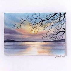 a watercolor painting of a sunset over a lake