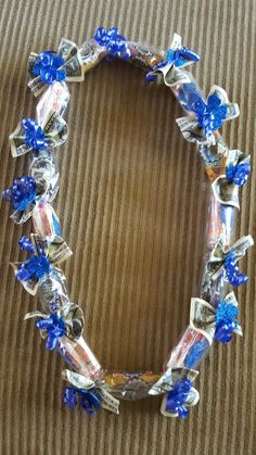 a bracelet with blue and silver flowers on it