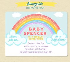 a baby shower party with rainbows and clouds on the front, blue sky in the background