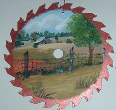 a painting on the side of a wall with a tree and fence in it's center