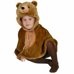 a young child dressed in a bear costume