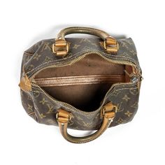 This Louis Vuitton Mini Speedy bag is in great but well-loved condition, with a classic gold monogram exterior and an iconic shape. The spacious interior offers plenty of room for all your everyday essentials, while the zipped top closure ensures everything stays secure. This timeless piece is both practical and stylish, making it a great addition to anyone's wardrobe. Classic Monogram Canvas Satchel With Gold-tone Hardware, Classic Bags In Monogram Canvas With Lock, Classic Bags With Lock In Monogram Canvas, Classic Gold Signature Coated Canvas Bag, Classic Bag With Lock In Monogram Canvas, Gold Signature Coated Canvas Bag For Everyday, Travel Bag With Brass Hardware And Monogram Canvas, Vintage Monogram Canvas Satchel, Luxury Bag In Monogram Canvas With Brass Hardware