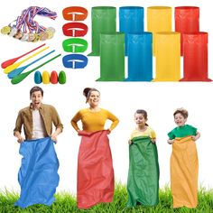 a group of people standing next to each other in front of some colorful plastic objects