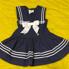 Navy And White Dress. Never Worn Navy Fitted Cute Dress, Cute Fitted Navy Dress, White Cotton School Dress, White Cotton Dresses For School, Blue Cotton Sailor Dress, White Sailor Dresses For Spring, Blue Sailor Cotton Dress, Navy School Dress For Spring, Blue Sailor Style Cotton Dress