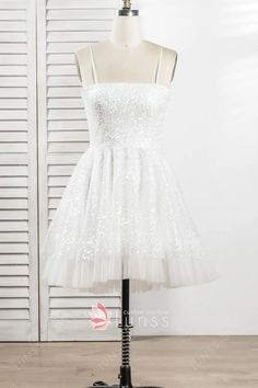 sparkly ivory white glitter sequin short homecoming dress White Glitter Cocktail Dress, White Sparkly Short Dress, Sequin Dress For Wedding And Prom With Spaghetti Straps, Sequin Dress With Spaghetti Straps For Wedding Party, Sequin Spaghetti Strap Dress For Wedding And Parties, Party Season Wedding Sequin Dress With Spaghetti Straps, White Sequin Prom Dress For Party Season, White Sequin Dress For Prom Party Season, White Sequin Dress For Prom And Party Season