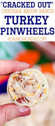 a hand holding a cracker filled with bacon ranch and turkey pinwheels