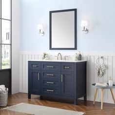 a bathroom vanity with two sinks and a large mirror above it on the wall next to a window