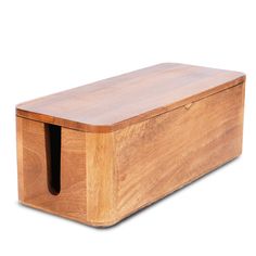 a wooden box that is sitting on a white surface with the lid open and two holes in it