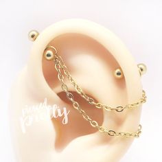 a fake ear with chains attached to it