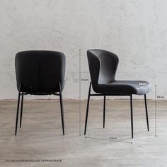 two black chairs sitting side by side in front of a white wall with measurements for each chair