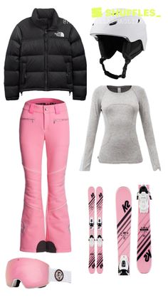 a woman's snow gear including skis, helmet and goggles is shown