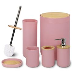 pink bathroom accessories including soap dispenser, toothbrush holder, and cup