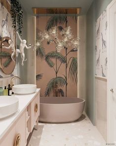 a bathroom with two sinks and a bathtub next to a wallpapered palm tree