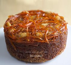 a close up of a cake on a plate with orange peels around the edges