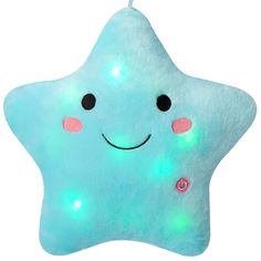 a light up star shaped pillow with eyes