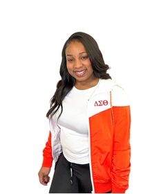 Red and White Delta Windbreaker. Delta Sigma Theta on left side and Crest on the back.  Runs true to size. Model is wearing a small.  *May appear orangish in the picture but is red. Delta Sigma Theta, Minneapolis, Gender Neutral, Red And White, Bathing Beauties, Adult Outfits, Jackets & Coats, Models, Music Clothes