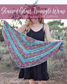 a woman holding up a crocheted triangle shawl with text that reads, strand glass triangle wrap free crochet pattern