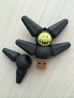 a black and yellow toy is attached to a usb stick that looks like an angry bird