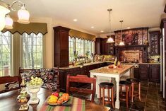 a large kitchen with wooden cabinets and marble counter tops, along with a breakfast nook