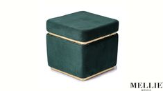 a green ottoman with gold trim on the top and bottom, sitting in front of a white background