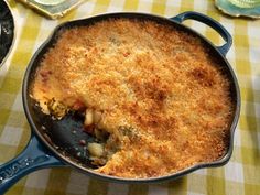 a close up of a pan with food in it on a table